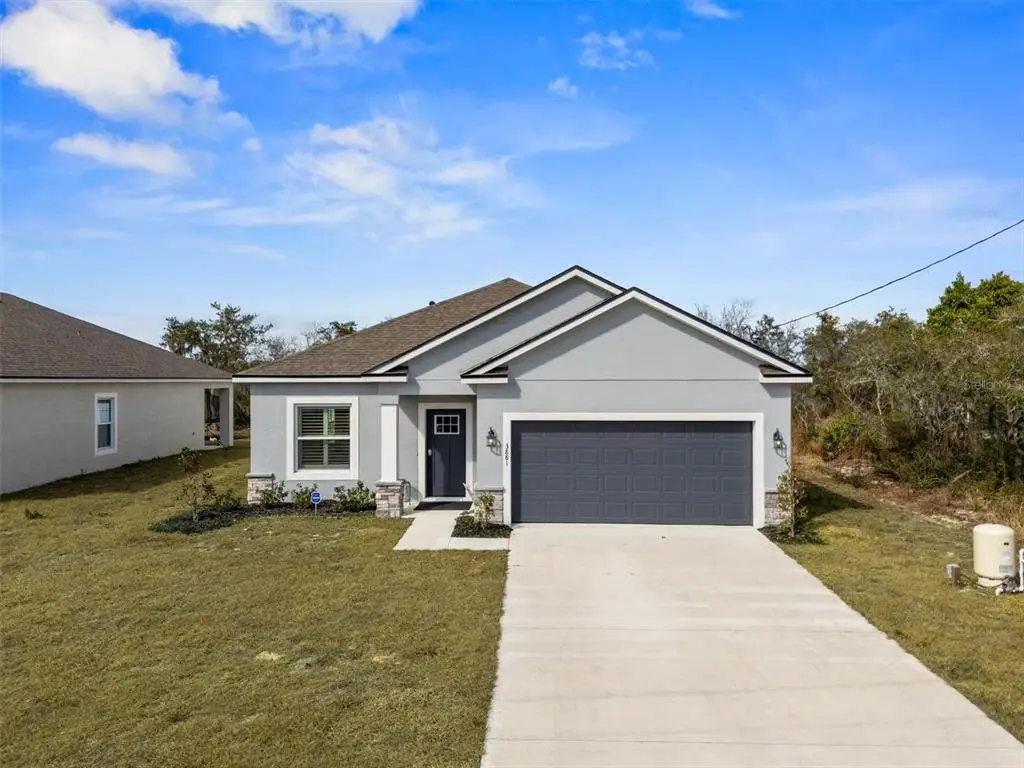 Front exterior of a new home in , Lake Wales, FL, highlighting curb appeal (Image 1). Front exterior of a new home in , Lake Wales, FL, highlighting curb appeal (Image 1).