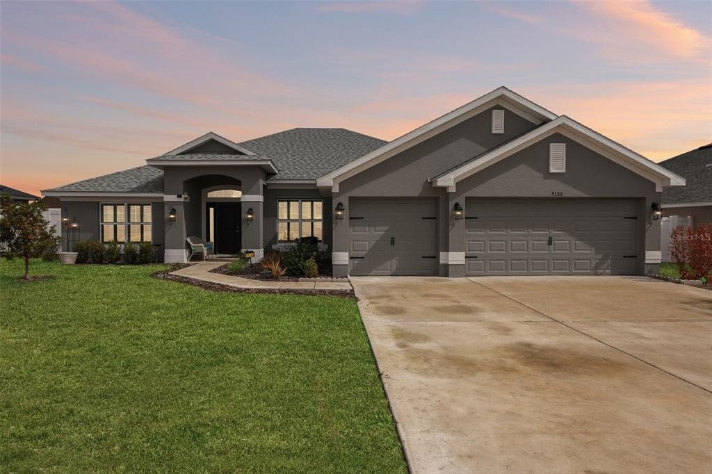 Front exterior of a new home in Oaks at Ocala Crossings, Ocala, FL, highlighting curb appeal (Image 1). Front exterior of a new home in Oaks at Ocala Crossings, Ocala, FL, highlighting curb appeal (Image 1).