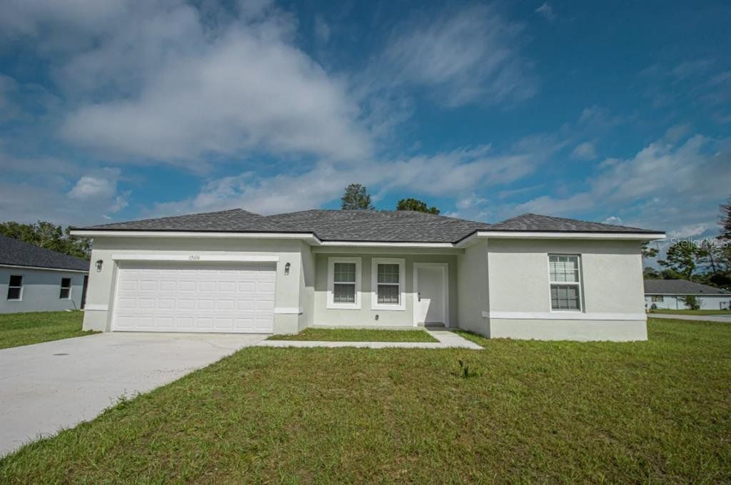 Front exterior of a new home in , Ocala, FL, highlighting curb appeal (Image 1). Front exterior of a new home in , Ocala, FL, highlighting curb appeal (Image 1).