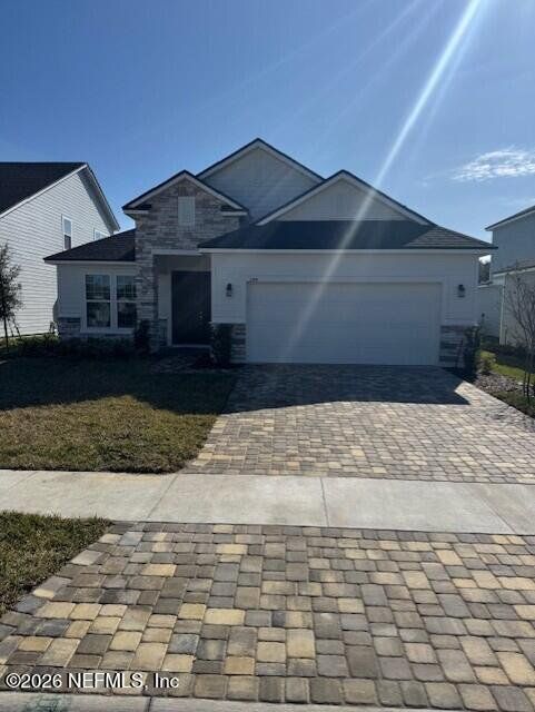 Front exterior of a new home in Brook Forest, St. Augustine, FL, highlighting curb appeal (Image 1). Front exterior of a new home in Brook Forest, St. Augustine, FL, highlighting curb appeal (Image 1).