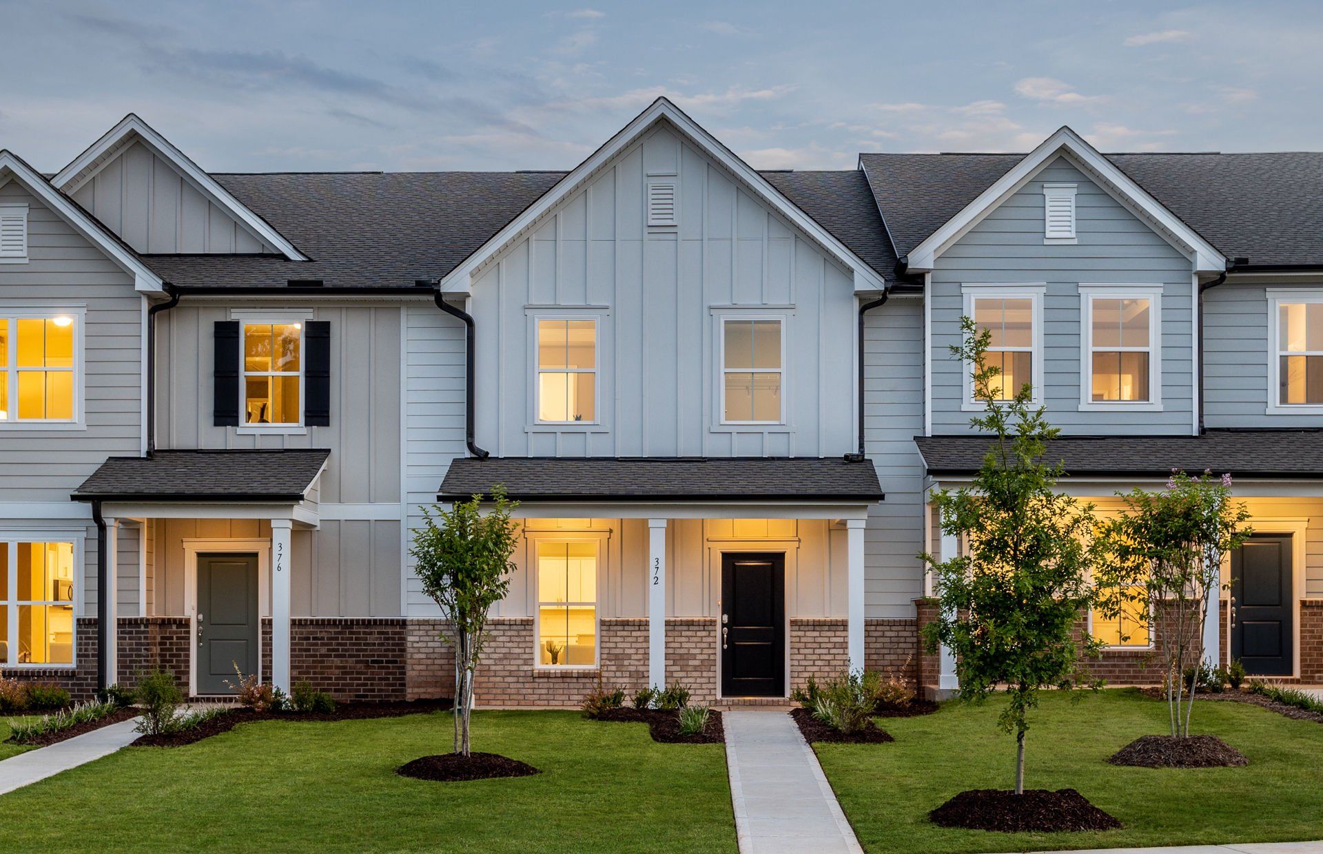 Front exterior of a new home in Exchange at 401, Raleigh, NC, highlighting curb appeal (Image 1). Front exterior of a new home in Exchange at 401, Raleigh, NC, highlighting curb appeal (Image 1).
