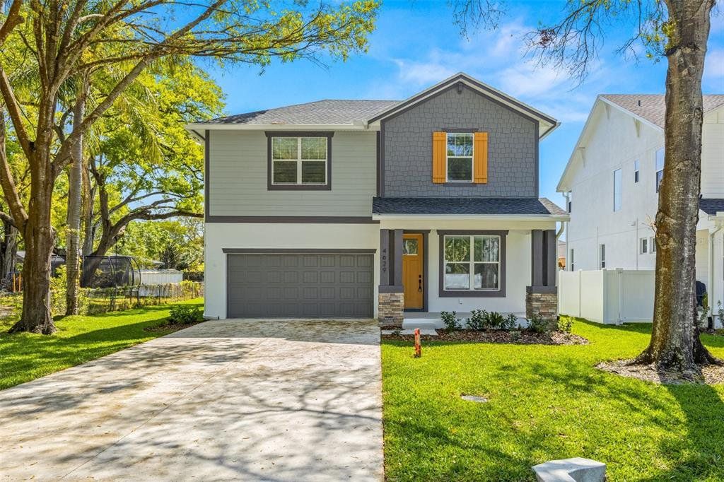 Front exterior of a new home in , Tampa, FL, highlighting curb appeal (Image 1). Front exterior of a new home in , Tampa, FL, highlighting curb appeal (Image 1).