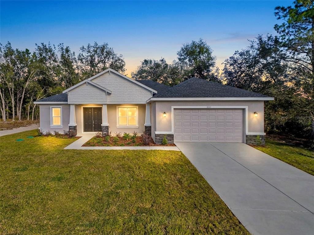 Front exterior of a new home in , Citrus Springs, FL, highlighting curb appeal (Image 1). Front exterior of a new home in , Citrus Springs, FL, highlighting curb appeal (Image 1).