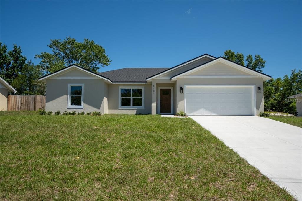 Front exterior of a new home in , Deltona, FL, highlighting curb appeal (Image 1). Front exterior of a new home in , Deltona, FL, highlighting curb appeal (Image 1).