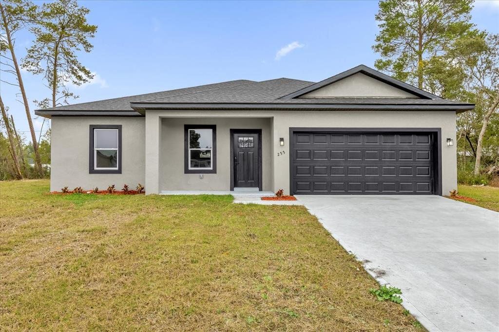 Front exterior of a new home in , Ocala, FL, highlighting curb appeal (Image 1). Front exterior of a new home in , Ocala, FL, highlighting curb appeal (Image 1).