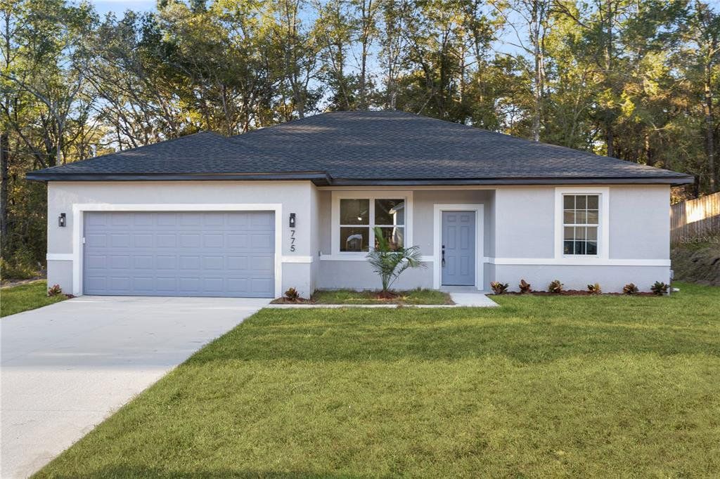 Front exterior of a new home in , Dunnellon, FL, highlighting curb appeal (Image 1). Front exterior of a new home in , Dunnellon, FL, highlighting curb appeal (Image 1).
