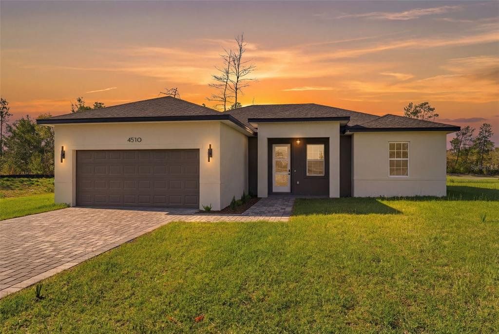 Front exterior of a new home in , Ocala, FL, highlighting curb appeal (Image 1). Front exterior of a new home in , Ocala, FL, highlighting curb appeal (Image 1).