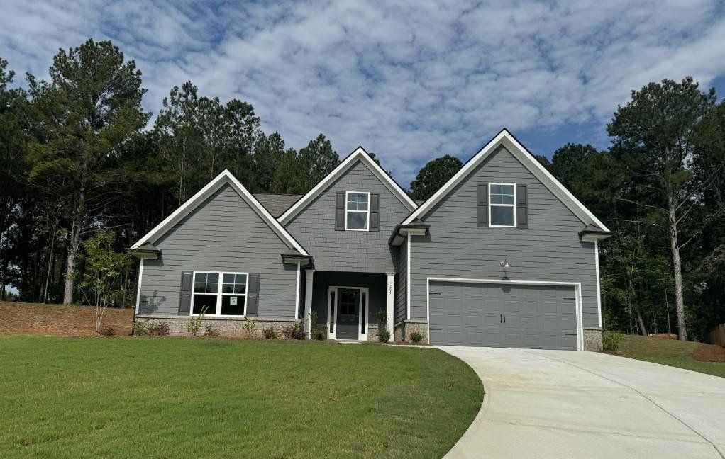 Front exterior of a new home in , Winder, GA, highlighting curb appeal (Image 1). Front exterior of a new home in , Winder, GA, highlighting curb appeal (Image 1).