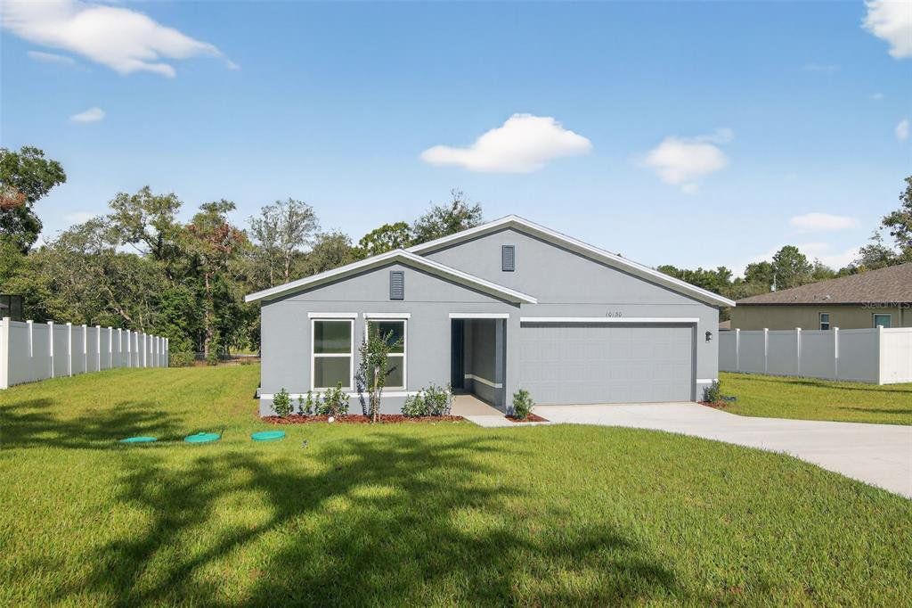 Front exterior of a new home in Citrus Springs, Citrus Springs, FL, highlighting curb appeal (Image 1). Front exterior of a new home in Citrus Springs, Citrus Springs, FL, highlighting curb appeal (Image 1).
