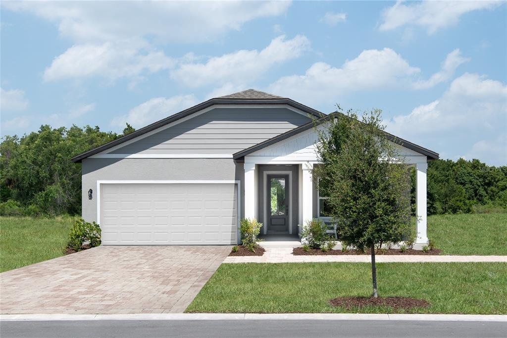 Front exterior of a new home in Hawks Run, Kissimmee, FL, highlighting curb appeal (Image 1). Front exterior of a new home in Hawks Run, Kissimmee, FL, highlighting curb appeal (Image 1).