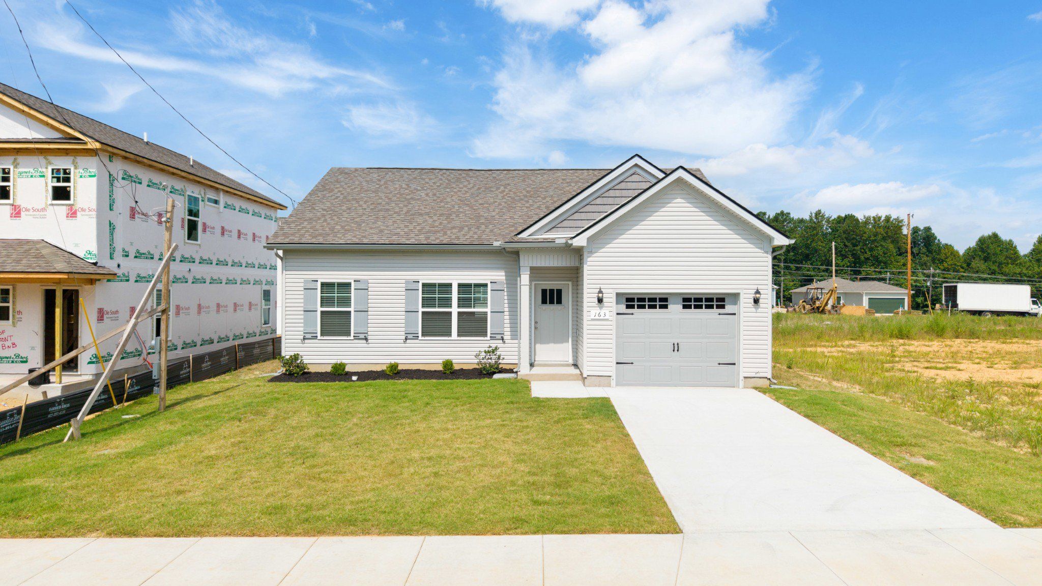 Front exterior of a new home in Stonehenge, Manchester, TN, highlighting curb appeal (Image 1). Front exterior of a new home in Stonehenge, Manchester, TN, highlighting curb appeal (Image 1).