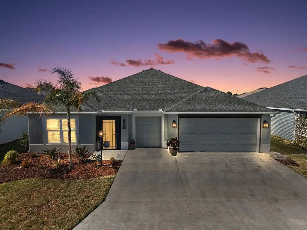 Front exterior of a new home in , The Villages, FL, highlighting curb appeal (Image 1). Front exterior of a new home in , The Villages, FL, highlighting curb appeal (Image 1).