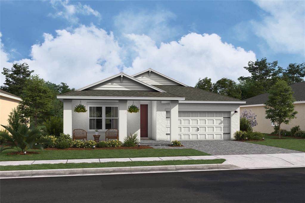 Front exterior of a new home in Aspire at Canter Creek, Davenport, FL, highlighting curb appeal (Image 1). Front exterior of a new home in Aspire at Canter Creek, Davenport, FL, highlighting curb appeal (Image 1).
