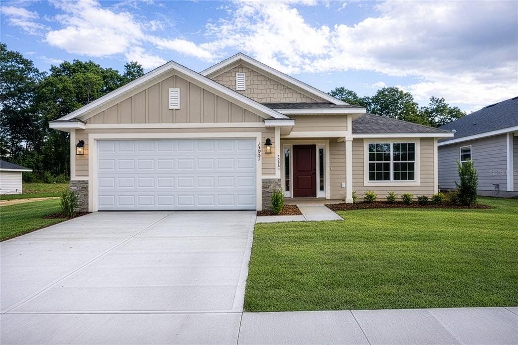 Front exterior of a new home in Kirkland Farms, Alachua, FL, highlighting curb appeal (Image 1). Front exterior of a new home in Kirkland Farms, Alachua, FL, highlighting curb appeal (Image 1).