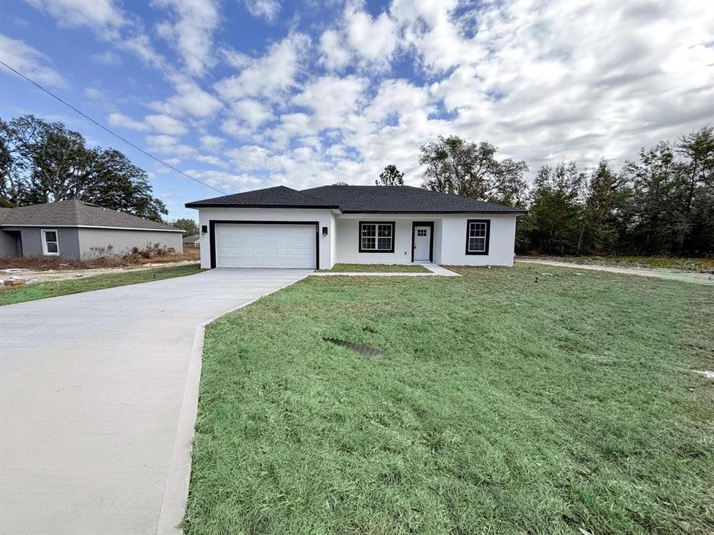 Front exterior of a new home in , Ocklawaha, FL, highlighting curb appeal (Image 1). Front exterior of a new home in , Ocklawaha, FL, highlighting curb appeal (Image 1).