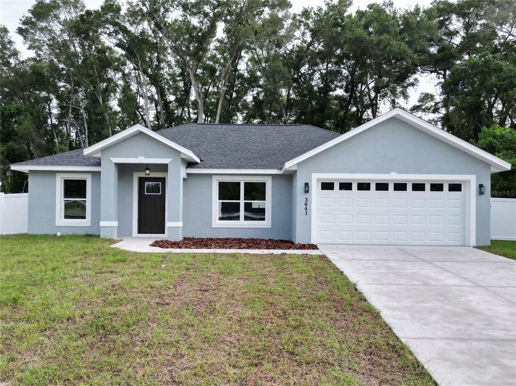 Front exterior of a new home in , Summerfield, FL, highlighting curb appeal (Image 1). Front exterior of a new home in , Summerfield, FL, highlighting curb appeal (Image 1).