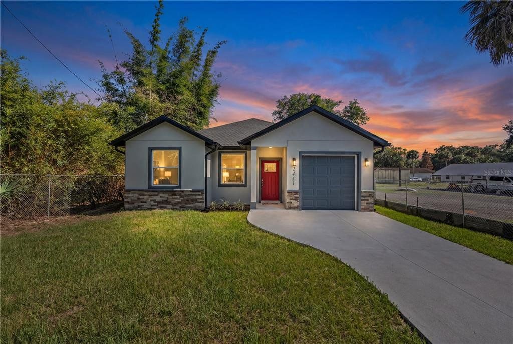 Front exterior of a new home in , Sanford, FL, highlighting curb appeal (Image 1). Front exterior of a new home in , Sanford, FL, highlighting curb appeal (Image 1).