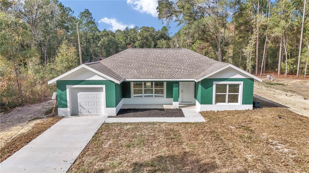 Front exterior of a new home in , Ocala, FL, highlighting curb appeal (Image 1). Front exterior of a new home in , Ocala, FL, highlighting curb appeal (Image 1).