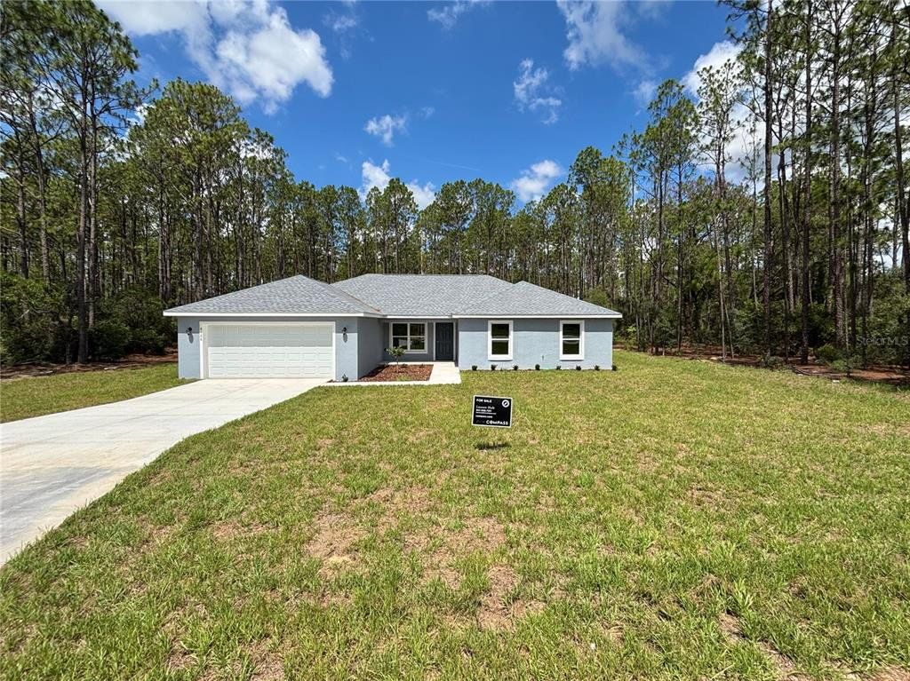 Front exterior of a new home in , Dunnellon, FL, highlighting curb appeal (Image 1). Front exterior of a new home in , Dunnellon, FL, highlighting curb appeal (Image 1).