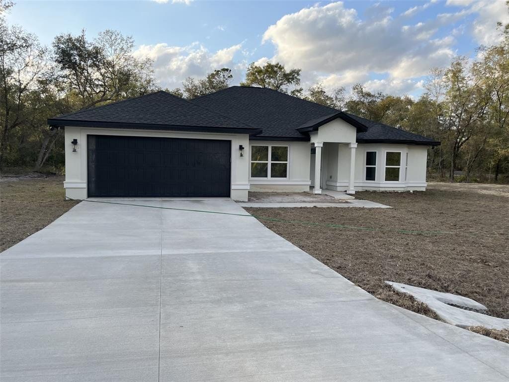 Front exterior of a new home in , Ocala, FL, highlighting curb appeal (Image 1). Front exterior of a new home in , Ocala, FL, highlighting curb appeal (Image 1).