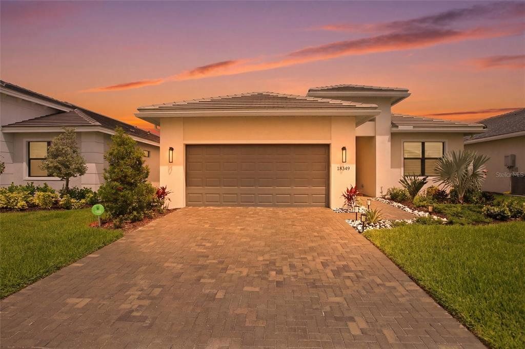 Front exterior of a new home in , Bradenton, FL, highlighting curb appeal (Image 1). Front exterior of a new home in , Bradenton, FL, highlighting curb appeal (Image 1).
