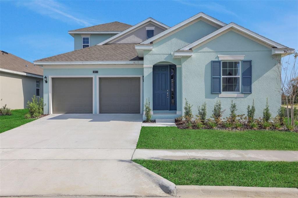 Front exterior of a new home in Crossroads at Kelly Park, Apopka, FL, highlighting curb appeal (Image 1). Front exterior of a new home in Crossroads at Kelly Park, Apopka, FL, highlighting curb appeal (Image 1).