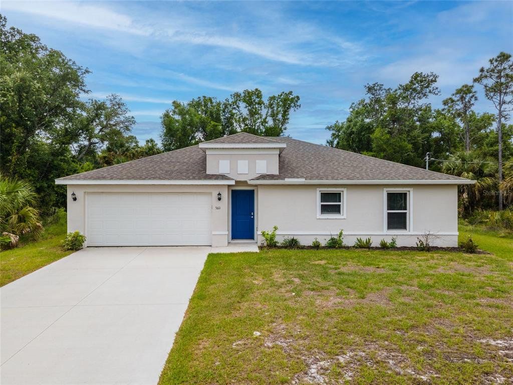 Front exterior of a new home in , North Port, FL, highlighting curb appeal (Image 1). Front exterior of a new home in , North Port, FL, highlighting curb appeal (Image 1).