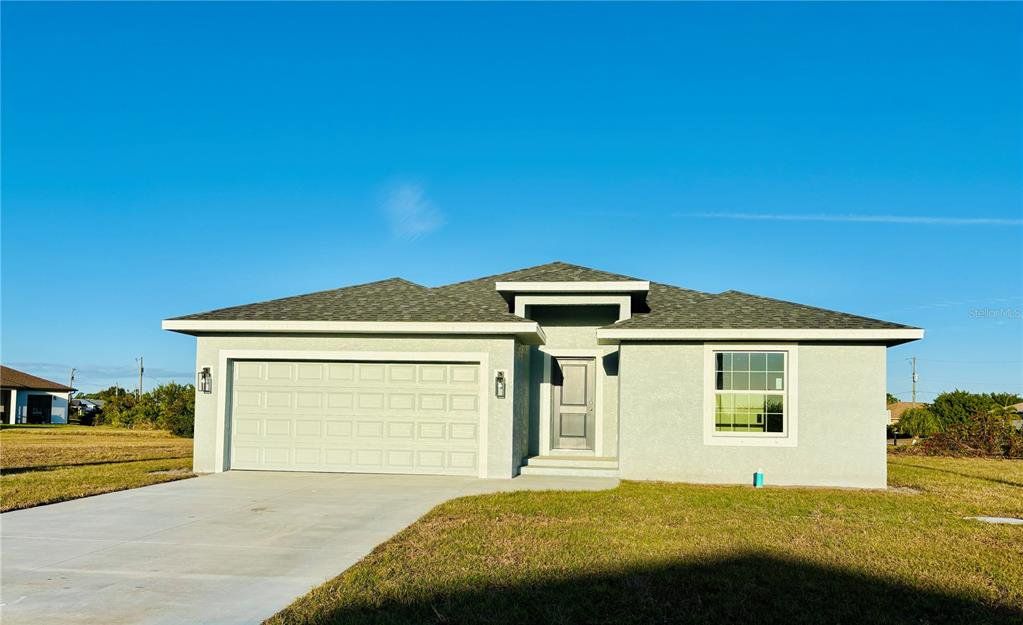 Front exterior of a new home in , Rotonda West, FL, highlighting curb appeal (Image 1). Front exterior of a new home in , Rotonda West, FL, highlighting curb appeal (Image 1).