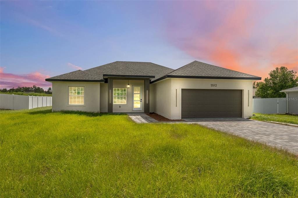 Front exterior of a new home in , Ocala, FL, highlighting curb appeal (Image 1). Front exterior of a new home in , Ocala, FL, highlighting curb appeal (Image 1).