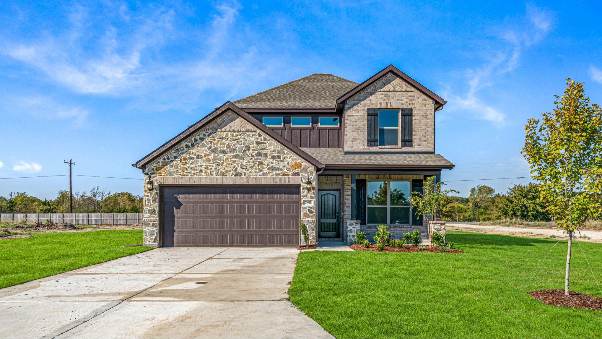 Front exterior of a new home in Mallard Point, Greenville, TX, highlighting curb appeal (Image 1). Front exterior of a new home in Mallard Point, Greenville, TX, highlighting curb appeal (Image 1).