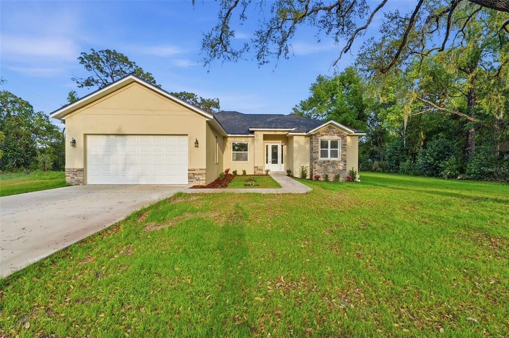 Front exterior of a new home in , Debary, FL, highlighting curb appeal (Image 1). Front exterior of a new home in , Debary, FL, highlighting curb appeal (Image 1).