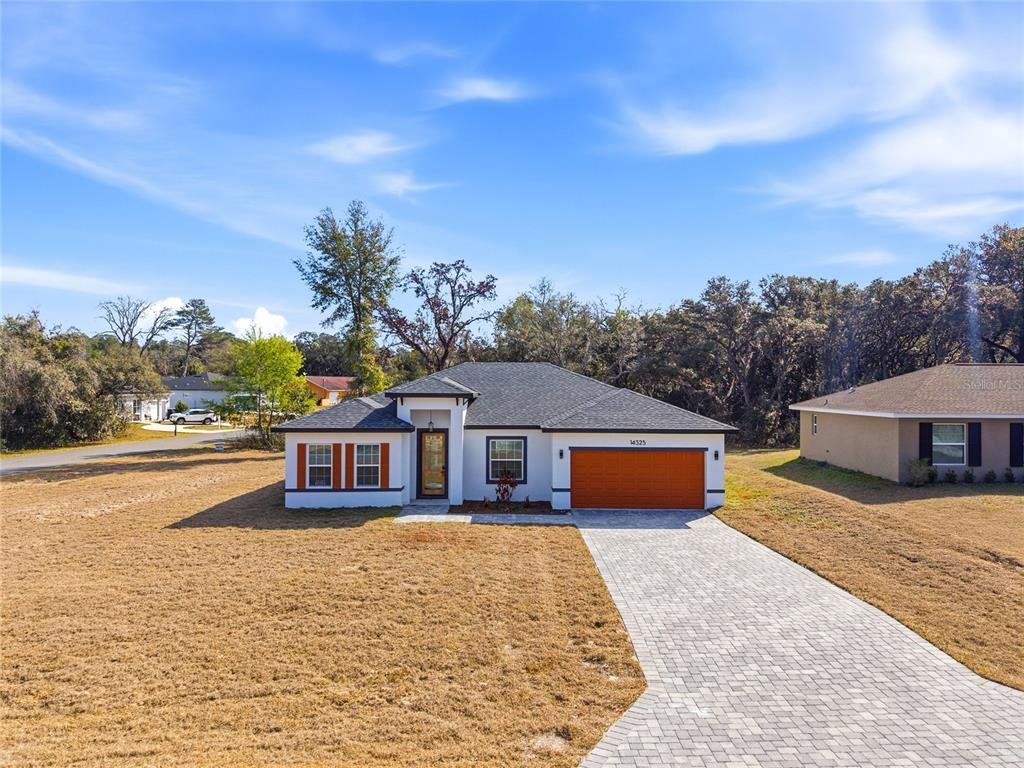 Front exterior of a new home in , Ocala, FL, highlighting curb appeal (Image 1). Front exterior of a new home in , Ocala, FL, highlighting curb appeal (Image 1).
