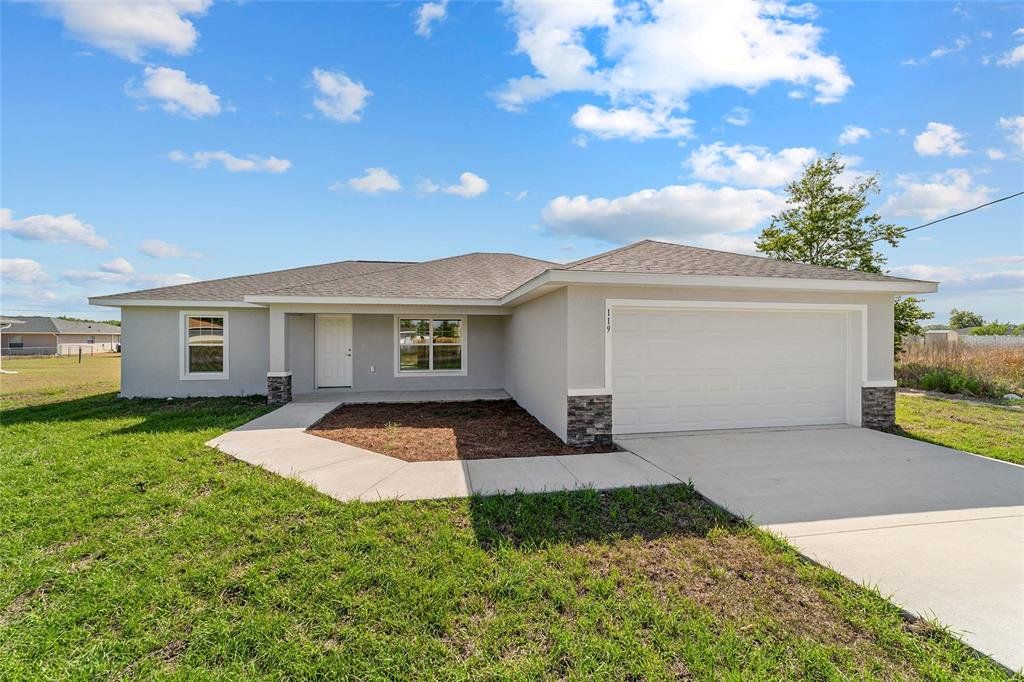 Front exterior of a new home in , Ocala, FL, highlighting curb appeal (Image 1). Front exterior of a new home in , Ocala, FL, highlighting curb appeal (Image 1).