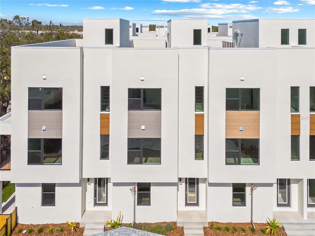 Front exterior of a new home in Alante, St. Petersburg, FL, highlighting curb appeal (Image 1). Front exterior of a new home in Alante, St. Petersburg, FL, highlighting curb appeal (Image 1).