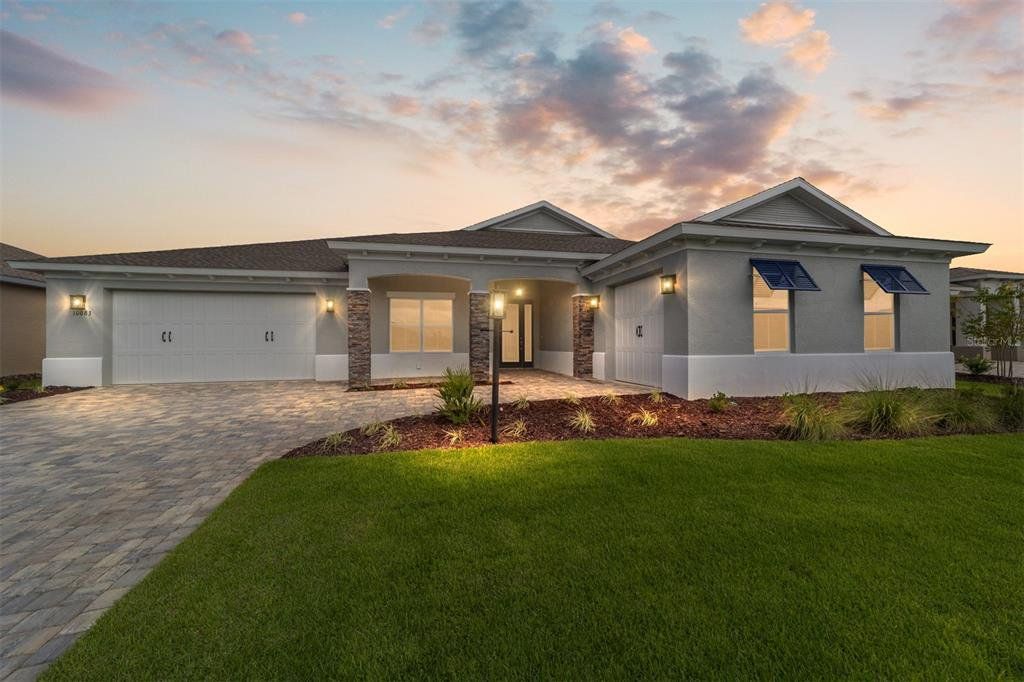 Front exterior of a new home in , Ocala, FL, highlighting curb appeal (Image 1). Front exterior of a new home in , Ocala, FL, highlighting curb appeal (Image 1).