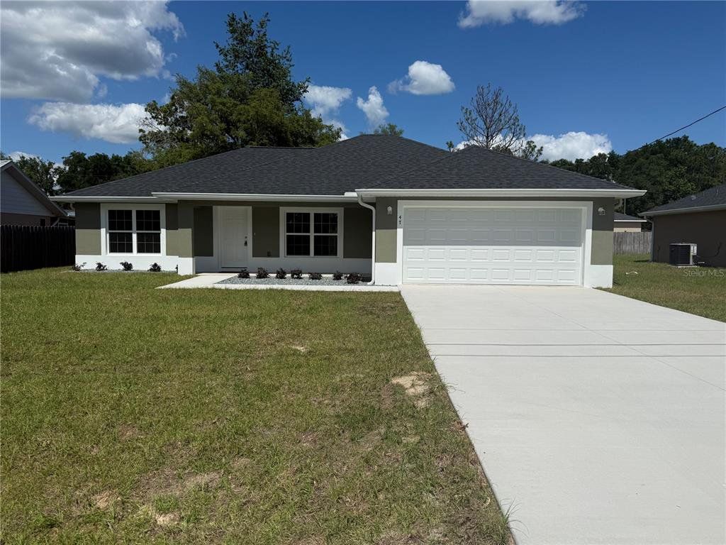 Front exterior of a new home in , Ocala, FL, highlighting curb appeal (Image 1). Front exterior of a new home in , Ocala, FL, highlighting curb appeal (Image 1).