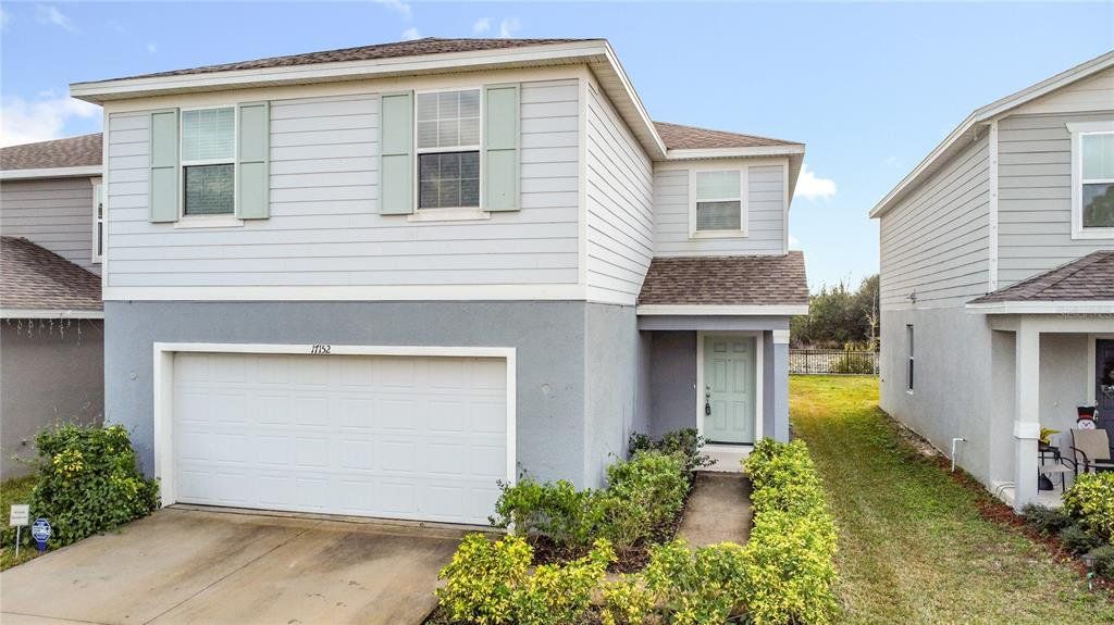 Front exterior of a new home in , Clermont, FL, highlighting curb appeal (Image 1). Front exterior of a new home in , Clermont, FL, highlighting curb appeal (Image 1).