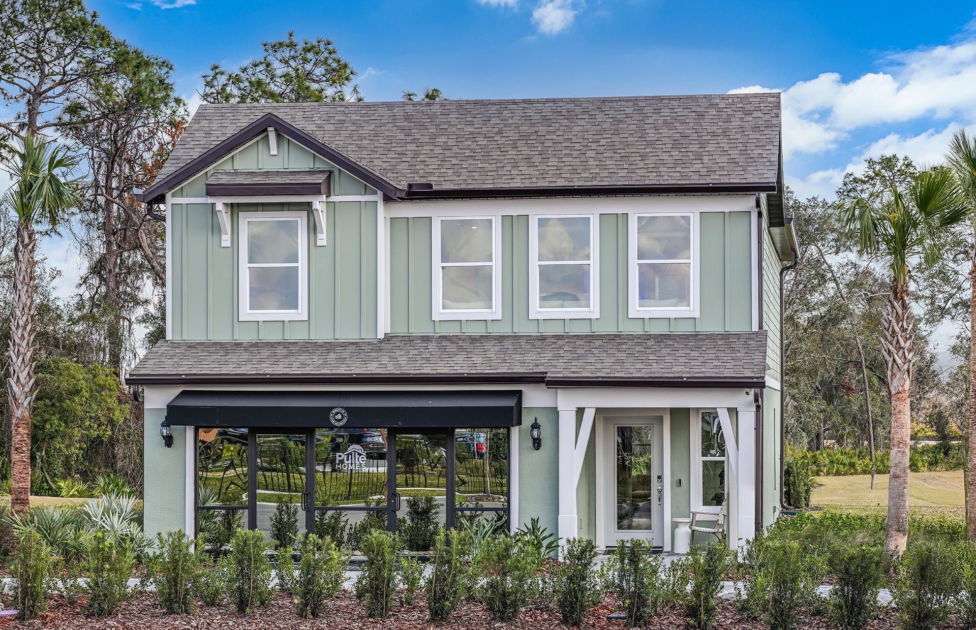Front exterior of a new home in Vida's Way, Wesley Chapel, FL, highlighting curb appeal (Image 1). Front exterior of a new home in Vida's Way, Wesley Chapel, FL, highlighting curb appeal (Image 1).
