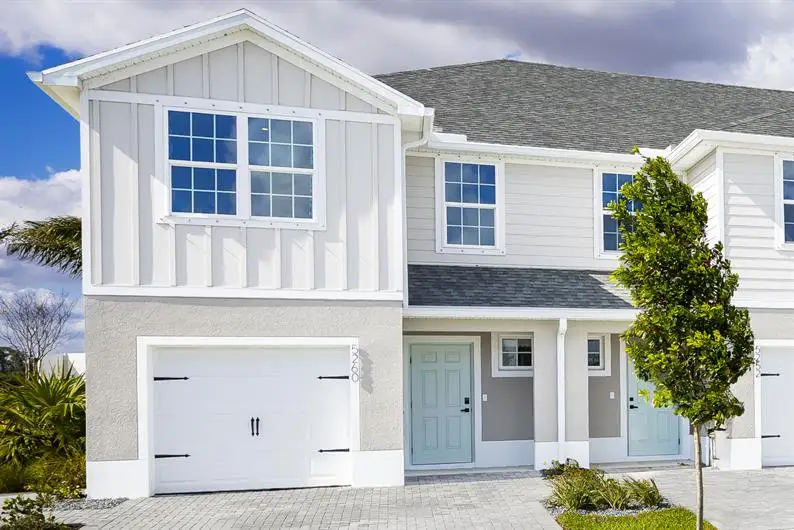 Front exterior of a new home in Waverly at Wylder, Port St. Lucie, FL, highlighting curb appeal (Image 1). Front exterior of a new home in Waverly at Wylder, Port St. Lucie, FL, highlighting curb appeal (Image 1).