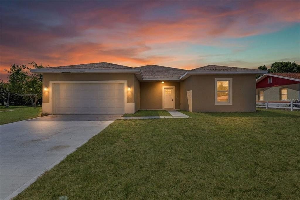 Front exterior of a new home in , Port Charlotte, FL, highlighting curb appeal (Image 1). Front exterior of a new home in , Port Charlotte, FL, highlighting curb appeal (Image 1).