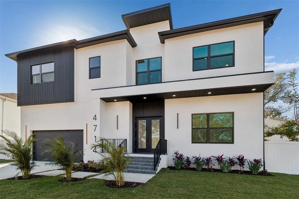 Front exterior of a new home in , Tampa, FL, highlighting curb appeal (Image 1). Front exterior of a new home in , Tampa, FL, highlighting curb appeal (Image 1).