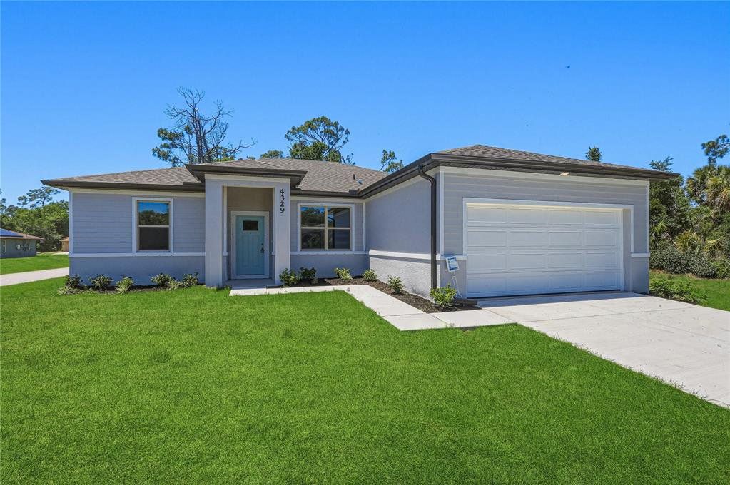 Front exterior of a new home in , North Port, FL, highlighting curb appeal (Image 1). Front exterior of a new home in , North Port, FL, highlighting curb appeal (Image 1).