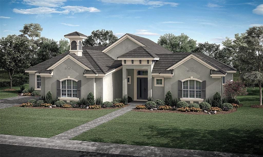 Front exterior of a new home in Toscana, Palm Coast, FL, highlighting curb appeal (Image 1).