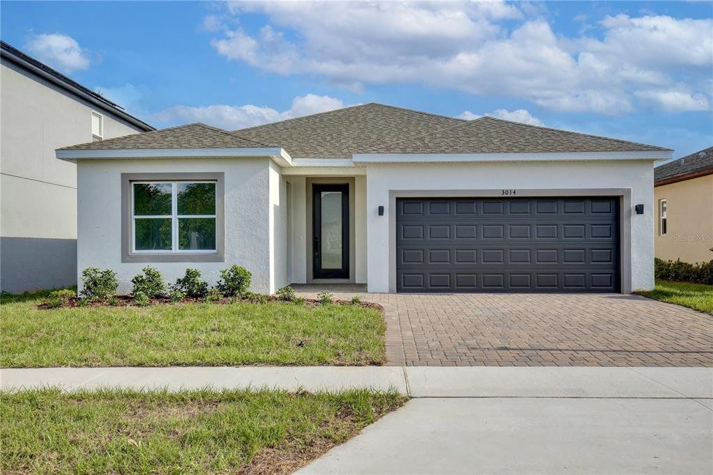 Front exterior of a new home in , Groveland, FL, highlighting curb appeal (Image 1). Front exterior of a new home in , Groveland, FL, highlighting curb appeal (Image 1).