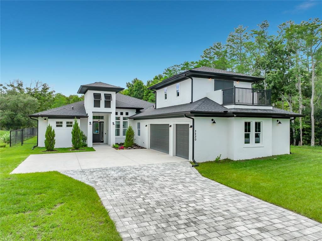 Front exterior of a new home in , Orlando, FL, highlighting curb appeal (Image 1). Front exterior of a new home in , Orlando, FL, highlighting curb appeal (Image 1).