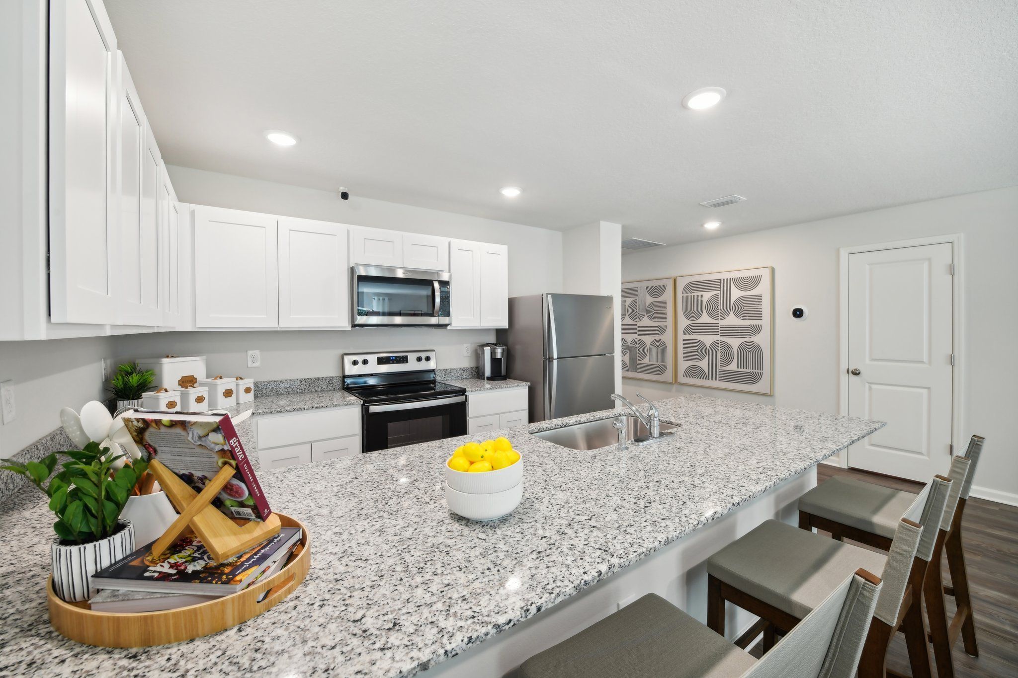 A kitchen with white cabinets. A kitchen with white cabinets.
