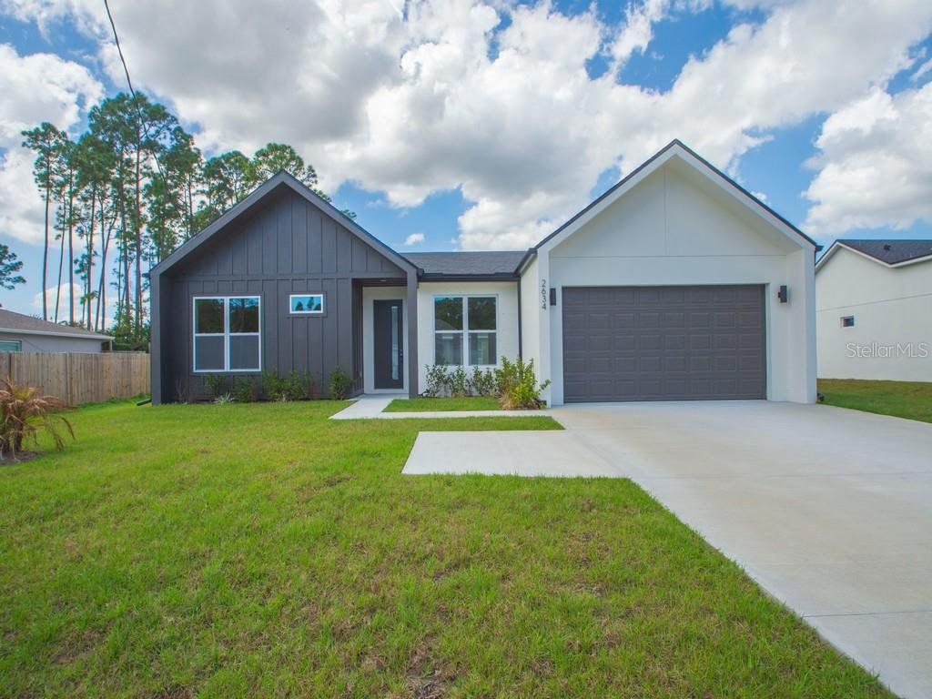 Front exterior of a new home in , Palm Bay, FL, highlighting curb appeal (Image 1). Front exterior of a new home in , Palm Bay, FL, highlighting curb appeal (Image 1).
