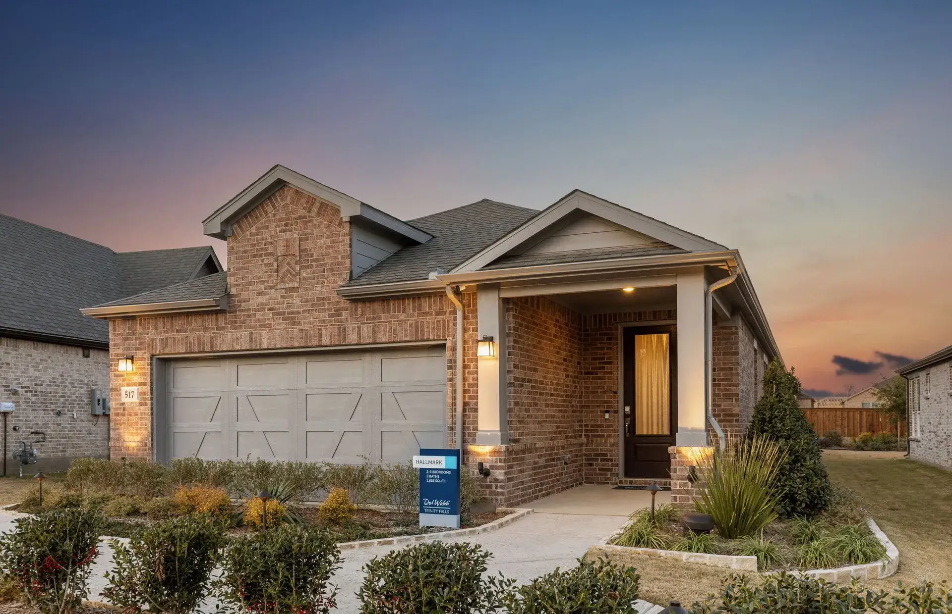 Front exterior of a new home in Del Webb at Trinity Falls, McKinney, TX, highlighting curb appeal (Image 1). Front exterior of a new home in Del Webb at Trinity Falls, McKinney, TX, highlighting curb appeal (Image 1).