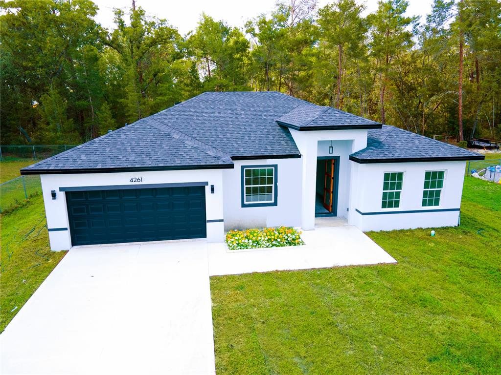 Front exterior of a new home in , Ocala, FL, highlighting curb appeal (Image 1). Front exterior of a new home in , Ocala, FL, highlighting curb appeal (Image 1).