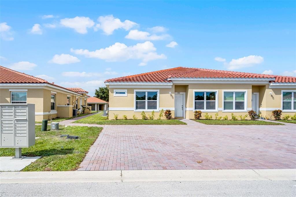 Front exterior of a new home in , Kissimmee, FL, highlighting curb appeal (Image 1).